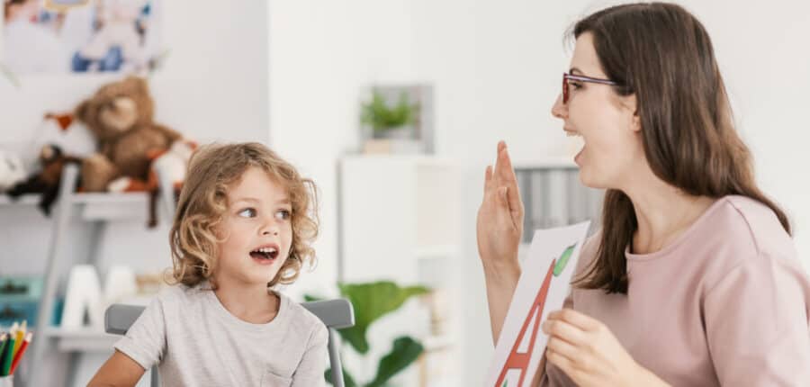 Tutor helping student with reading using phonics