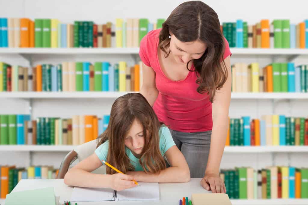 Tutor helping student with writing